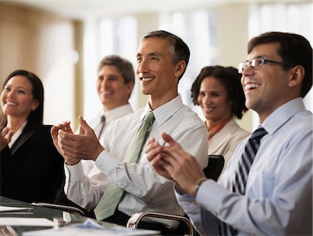 people working sitting in a row - Business colleagues applauding in office Stock Photo - Premium Royalty-Free, Code: 614-06044415