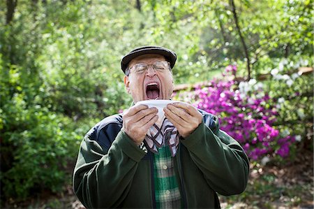 someone about to sneeze - Senior man about to sneeze outdoors Stock Photo - Premium Royalty-Free, Code: 614-06044633