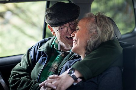 passenger - Senior couple embracing in the back of car Stock Photo - Premium Royalty-Free, Code: 614-06044640