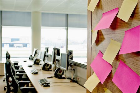 Sticky notes on wall in empty office Stock Photo - Premium Royalty-Free, Code: 614-06044732