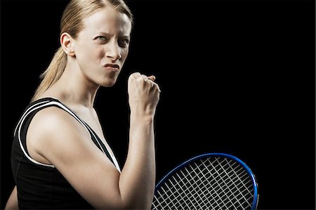 Tennis player punching the air Foto de stock - Royalty Free Premium, Número: 614-06043530