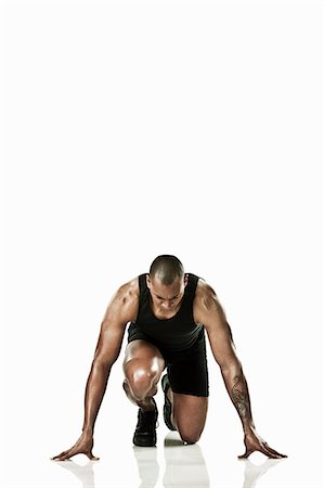 portrait tattoos for men - Athlete starting race Stock Photo - Premium Royalty-Free, Code: 614-06043557