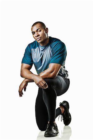 fitness man portrait not woman not group - Portrait of athlete kneeling Stock Photo - Premium Royalty-Free, Code: 614-06043559