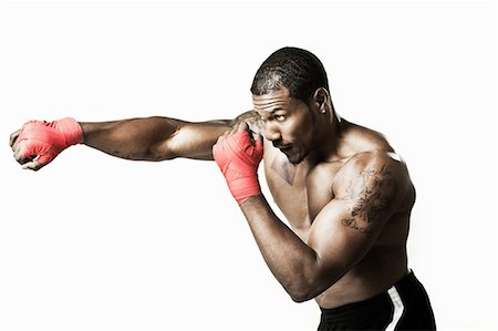 Boxer punching Foto de stock - Sin royalties Premium, Código: 614-06043565