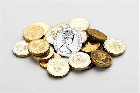 silver color - Pile of british coins Stock Photo - Premium Royalty-Free, Code: 614-06043712