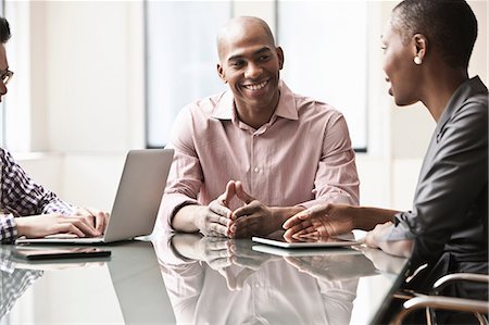 Three business people in meeting Stock Photo - Premium Royalty-Free, Code: 614-06043756