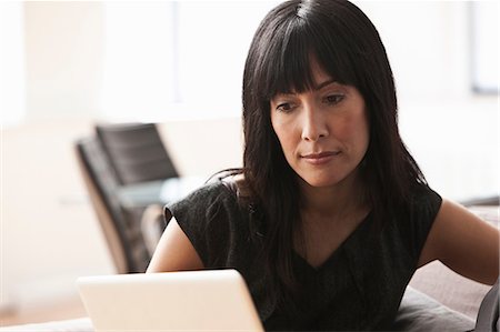 female native american - Mature woman using laptop Stock Photo - Premium Royalty-Free, Code: 614-06043773