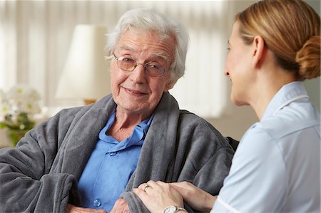 senior nurse care - Carer touching senior mans arm Stock Photo - Premium Royalty-Free, Code: 614-06043834