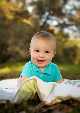 Baby boy on blanket in the park Stock Photo - Premium Royalty-Free, Code: 614-06043986
