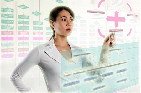 simsearch:614-06974084,k - Woman interacting with holographic screens Foto de stock - Sin royalties Premium, Código: 614-06043999