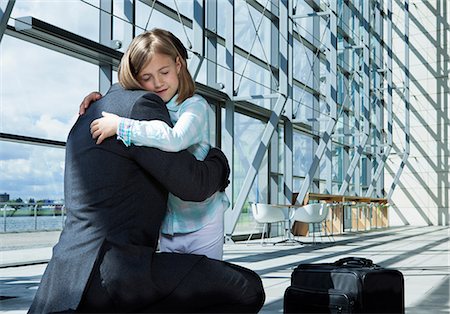 returns - Father arriving in airport with daughter Stock Photo - Premium Royalty-Free, Code: 614-06116001