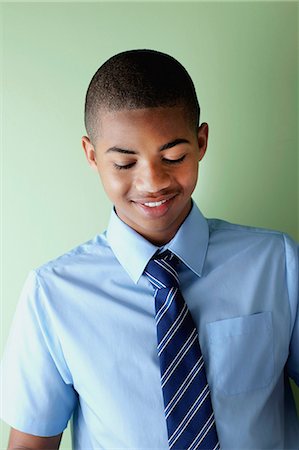 smiling teen boy portrait - Schoolboy smiling Foto de stock - Sin royalties Premium, Código: 614-06116417