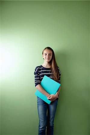 smart casual - Schoolgirl with ringbinder Stock Photo - Premium Royalty-Free, Code: 614-06116424