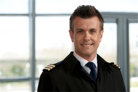 pilot - Pilot looking at camera, portrait Stock Photo - Premium Royalty-Free, Code: 614-06116482