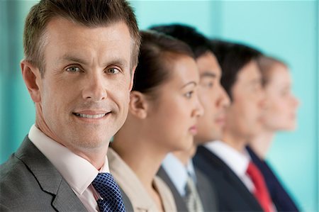 simsearch:614-06116477,k - Multi racial businesspeople in a line, portrait Stock Photo - Premium Royalty-Free, Code: 614-06116511