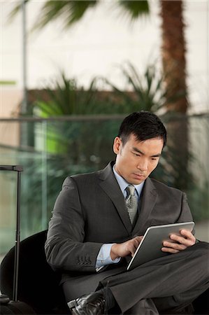 Businessman with digital tablet Stock Photo - Premium Royalty-Free, Code: 614-06116520