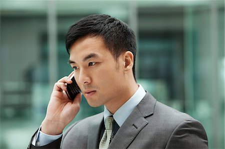 simsearch:614-02003461,k - Young businessman on cell phone, portrait Stock Photo - Premium Royalty-Free, Code: 614-06116523