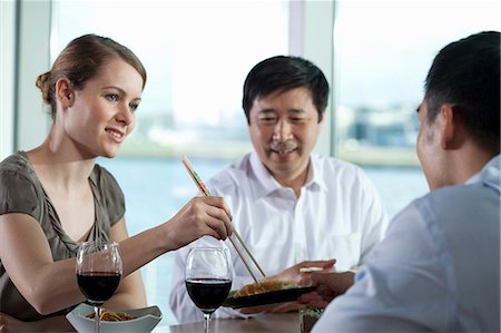 simsearch:614-06116477,k - Multi racial businesspeople eating meal Stock Photo - Premium Royalty-Free, Code: 614-06116536