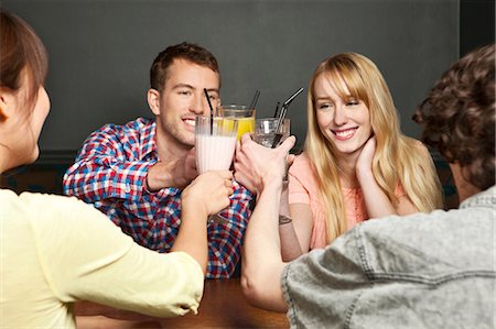 four people cheers - Friends toasting with soft drinks Stock Photo - Premium Royalty-Free, Code: 614-06168767