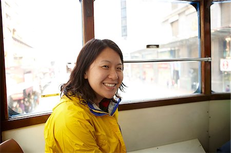 Portrait of woman in tram Stock Photo - Premium Royalty-Free, Code: 614-06168774