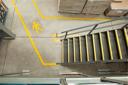 steps high angle - Steps and yellow lines in warehouse, elevated view Stock Photo - Premium Royalty-Free, Code: 614-06169130