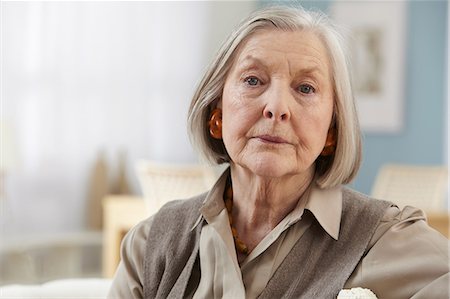 senior woman alone thinking - Senior woman looking at camera, portrait Stock Photo - Premium Royalty-Free, Code: 614-06169255