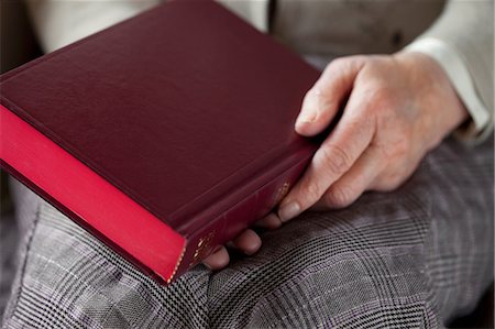 Senior woman holding hardback book Stock Photo - Premium Royalty-Free, Code: 614-06169278