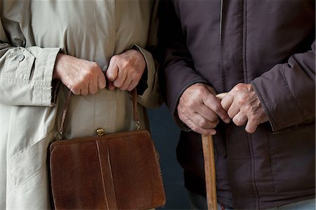 Senior man with walking stick, senior woman with handbag Stock Photo - Premium Royalty-Free, Code: 614-06169285