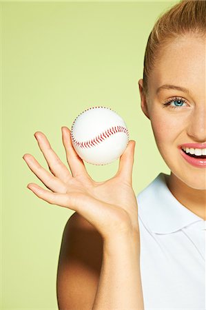 simsearch:614-06169479,k - Young woman holding baseball Stock Photo - Premium Royalty-Free, Code: 614-06169488