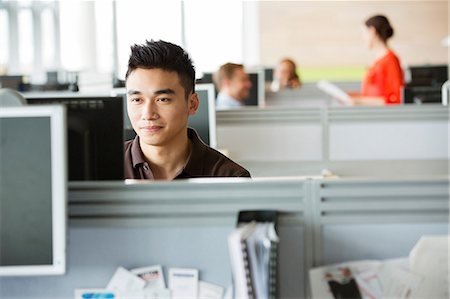 focused office worker - Young man working in office Stock Photo - Premium Royalty-Free, Code: 614-06169546