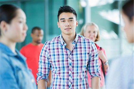 simsearch:614-06169585,k - Young man in crowd Foto de stock - Royalty Free Premium, Número: 614-06169551