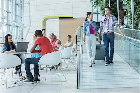 ramps - Young couple with suitcase on ramp to canteen area Stock Photo - Premium Royalty-Free, Code: 614-06169565