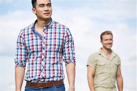 Two young men outdoors, focus on man in foreground Stock Photo - Premium Royalty-Free, Code: 614-06169589
