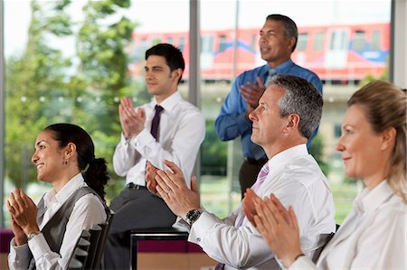Businesspeople clapping at meeting Stock Photo - Premium Royalty-Free, Code: 614-06311647