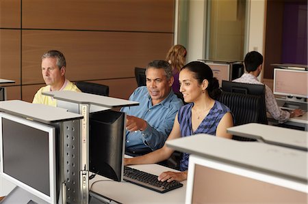 Mature students in computer class Stock Photo - Premium Royalty-Free, Code: 614-06311693