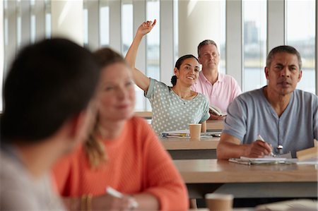 Mature students in class, woman with hand up Stock Photo - Premium Royalty-Free, Code: 614-06311704