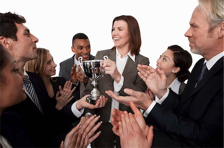 simsearch:614-06116477,k - Businesswoman receiving trophy, colleagues clapping Stock Photo - Premium Royalty-Free, Code: 614-06311784