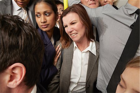 Woman and man with sweaty armpit on crowded subway train Foto de stock - Sin royalties Premium, Código: 614-06311785