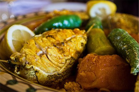 restaurant plate nobody - Tunisian restaurant dish of grouper with vegetables, Djerba Stock Photo - Premium Royalty-Free, Code: 614-06311815