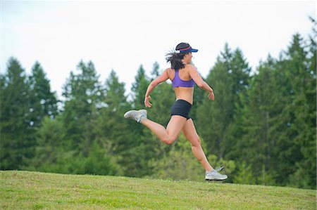 fast running - Young woman running in park Stock Photo - Premium Royalty-Free, Code: 614-06311864