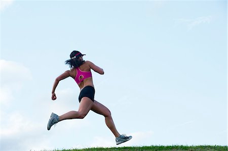 people run back view - Young woman running Stock Photo - Premium Royalty-Free, Code: 614-06311871