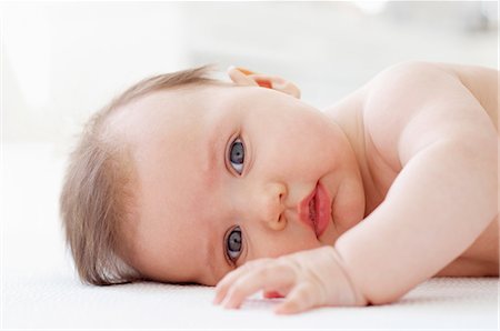 Baby girl, lying on side Stock Photo - Premium Royalty-Free, Code: 614-06312029