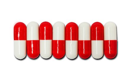 Row of red and white capsules Stock Photo - Premium Royalty-Free, Code: 614-06312085