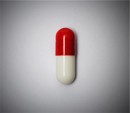 Red and white capsule Stock Photo - Premium Royalty-Free, Code: 614-06312097