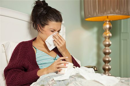 female teenage ill - Young woman in bed with cold Stock Photo - Premium Royalty-Free, Code: 614-06336003