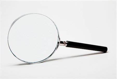 Magnifying glass Fotografie stock - Premium Royalty-Free, Codice: 614-06336014