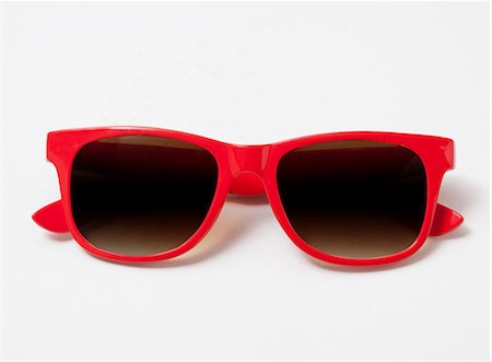 Pair of red sunglasses Fotografie stock - Premium Royalty-Free, Codice: 614-06336028