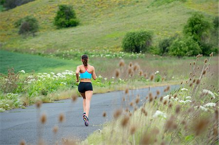 simsearch:614-06336230,k - Young woman running in rural setting Stock Photo - Premium Royalty-Free, Code: 614-06336231