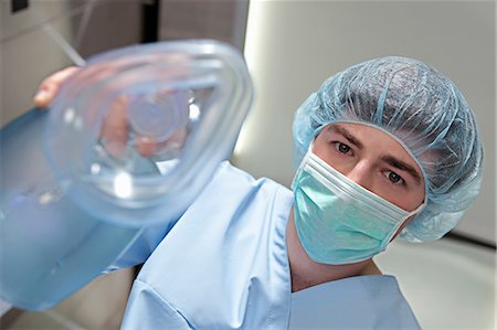 Anaesthetist with anaesthetic mask Fotografie stock - Premium Royalty-Free, Codice: 614-06336232