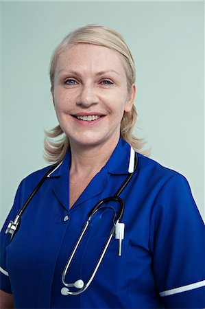 professional portraits with white background - Portrait of hospital nurse Stock Photo - Premium Royalty-Free, Code: 614-06336253